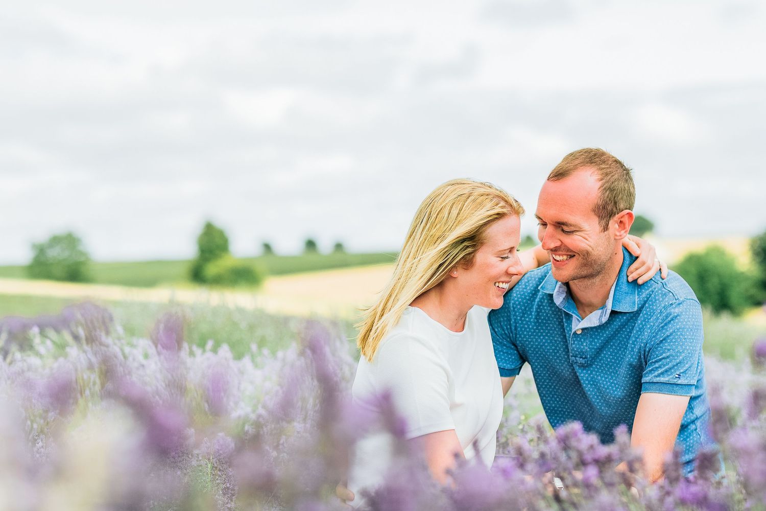 Hayley Elizabeth Photography Cotswolds Photographer Lavender engagement session Snowshill embracing together in field