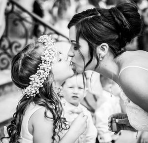 Bride kissing her flower girl at Highcliffe Castle