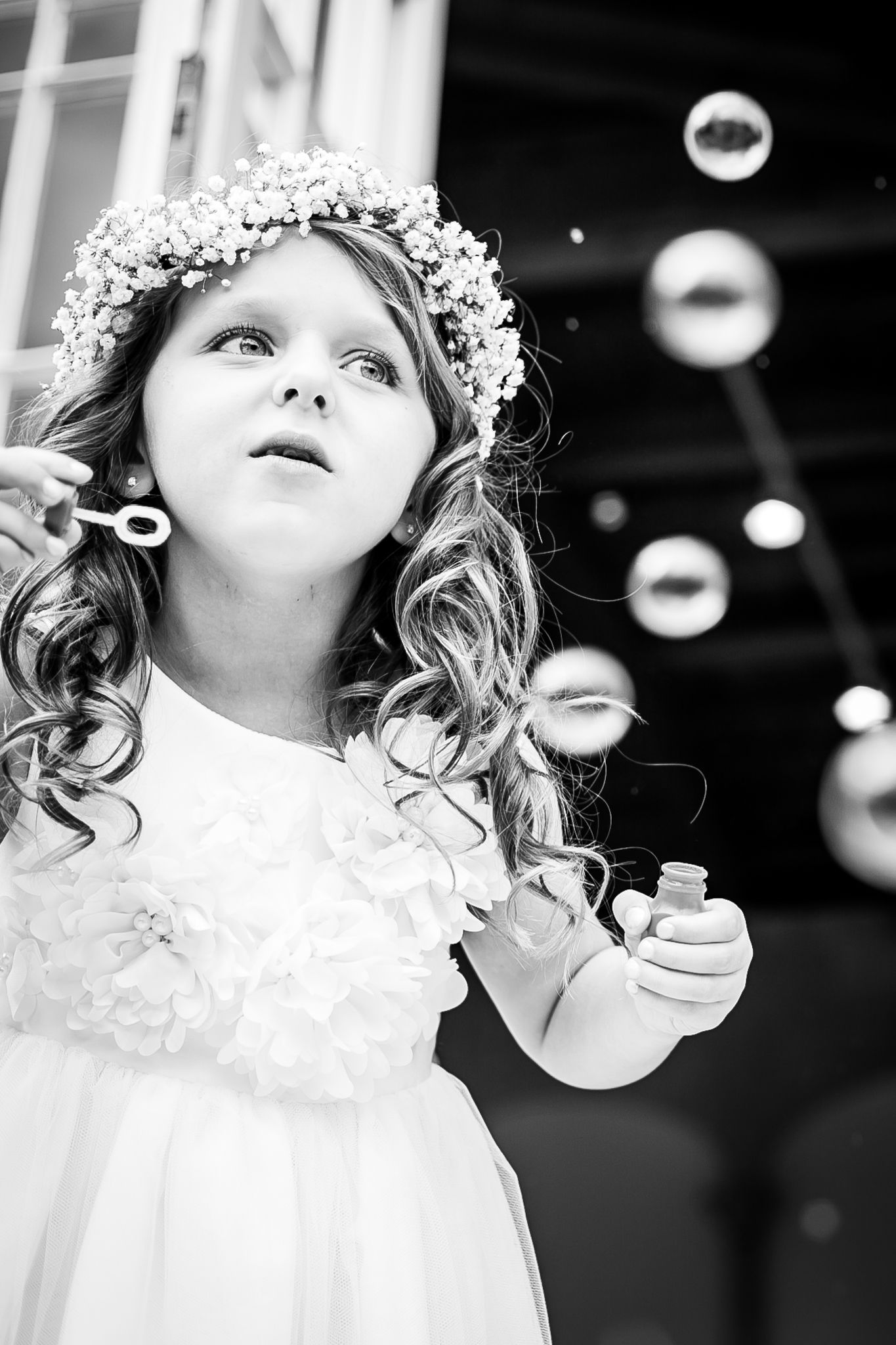 Flower girl blowing bubbles