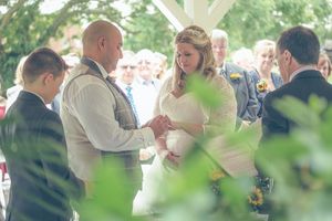 Bride and Groom exchange rings at the De Vere Oxford