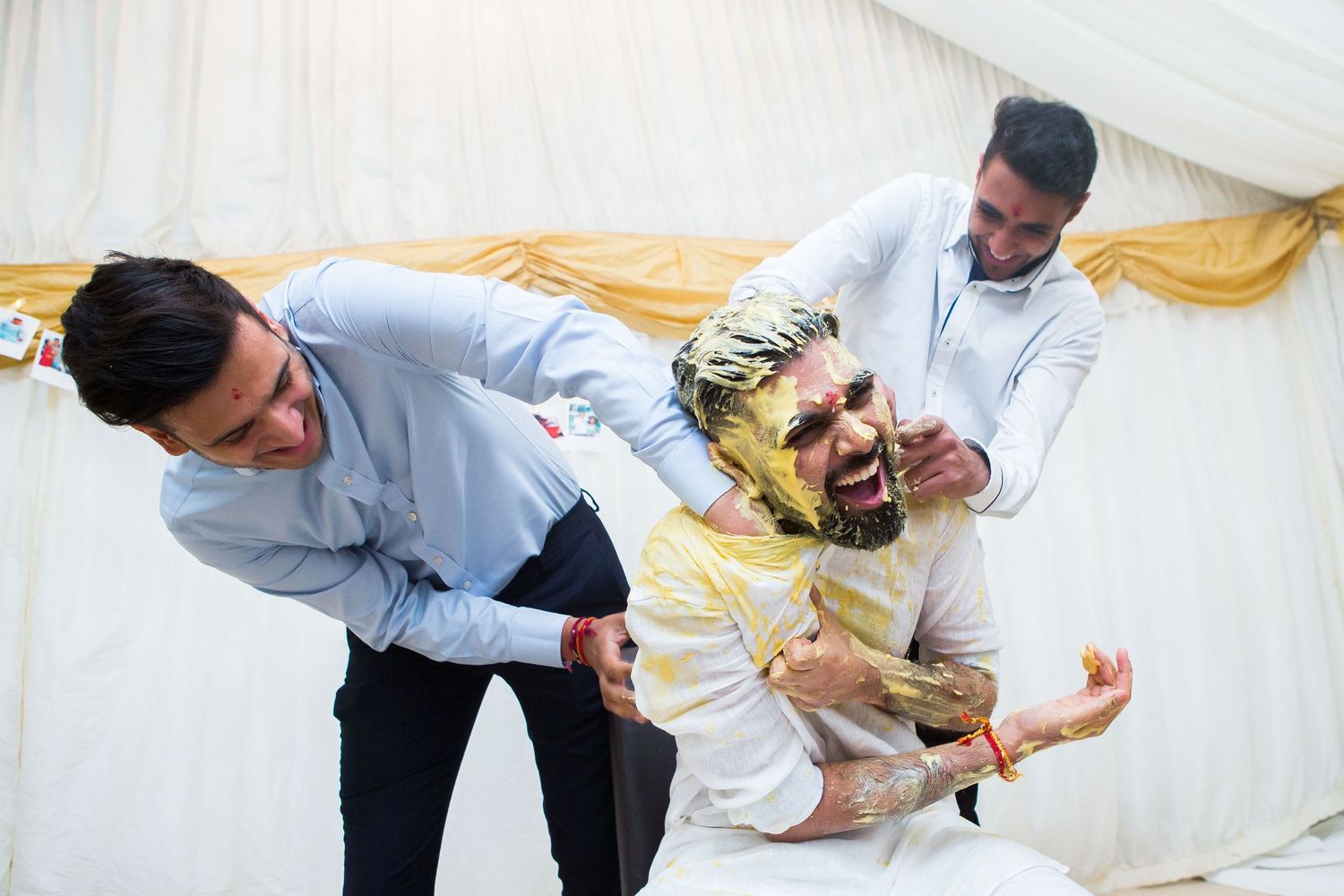 Rishan being attacked by friends and family on his pre wedding pithi function