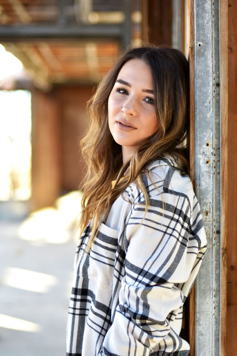 Girl leaning against door frame