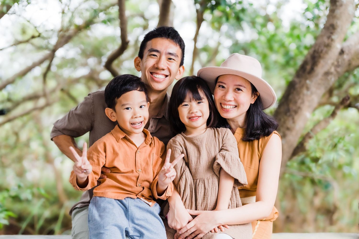 Happy family enjoying quality time together outdoors in a natural setting.
