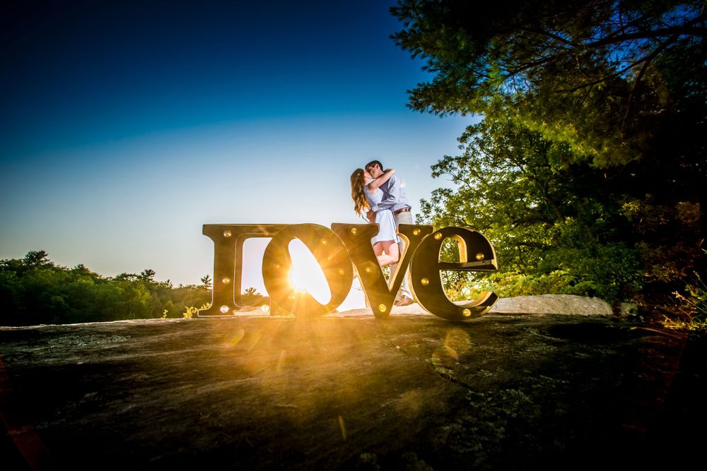 Romantic sunset silhouettes captured in a series of dramatic golden hour wedding photos.