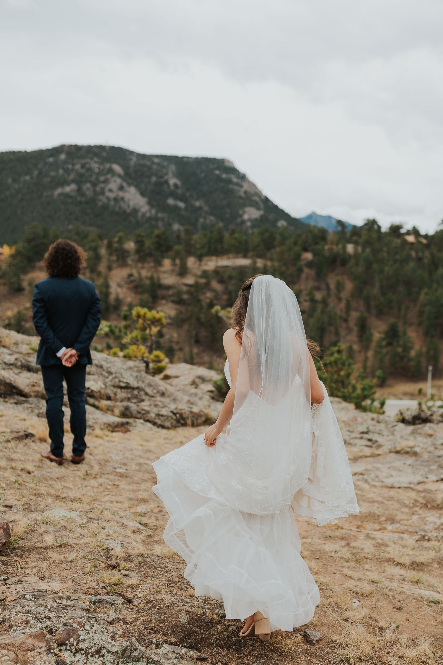 Groom and bride first look Bride and father first look Estes Park, Colorado wedding photographer