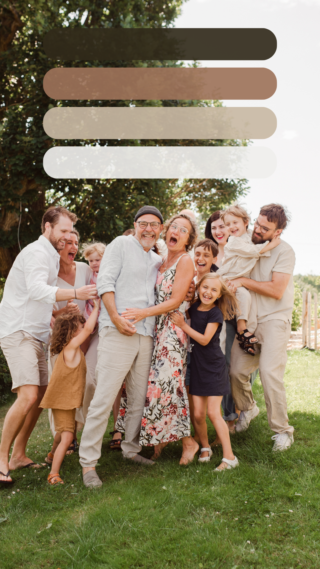 Large family group posing together outdoors while laughing and having fun in casual summer attire.