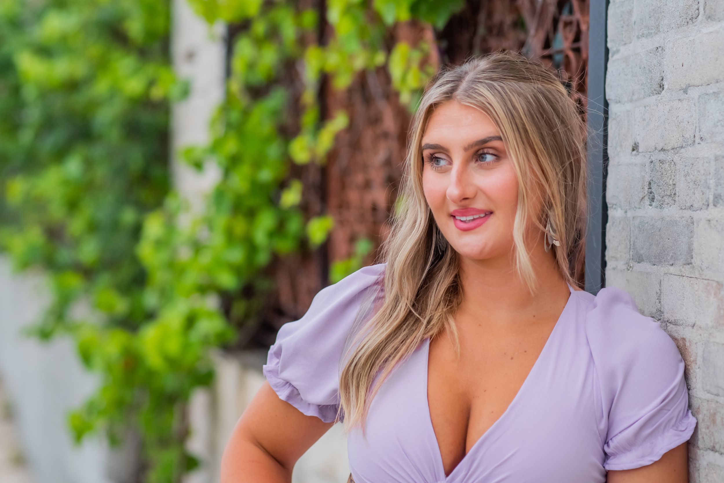 girls posing downtown during fun senior portrait session downtown Panama City Florida
