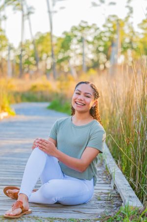 senior portrait laughing during a fun senior portrait photoshoot in Panama City Beach Florida