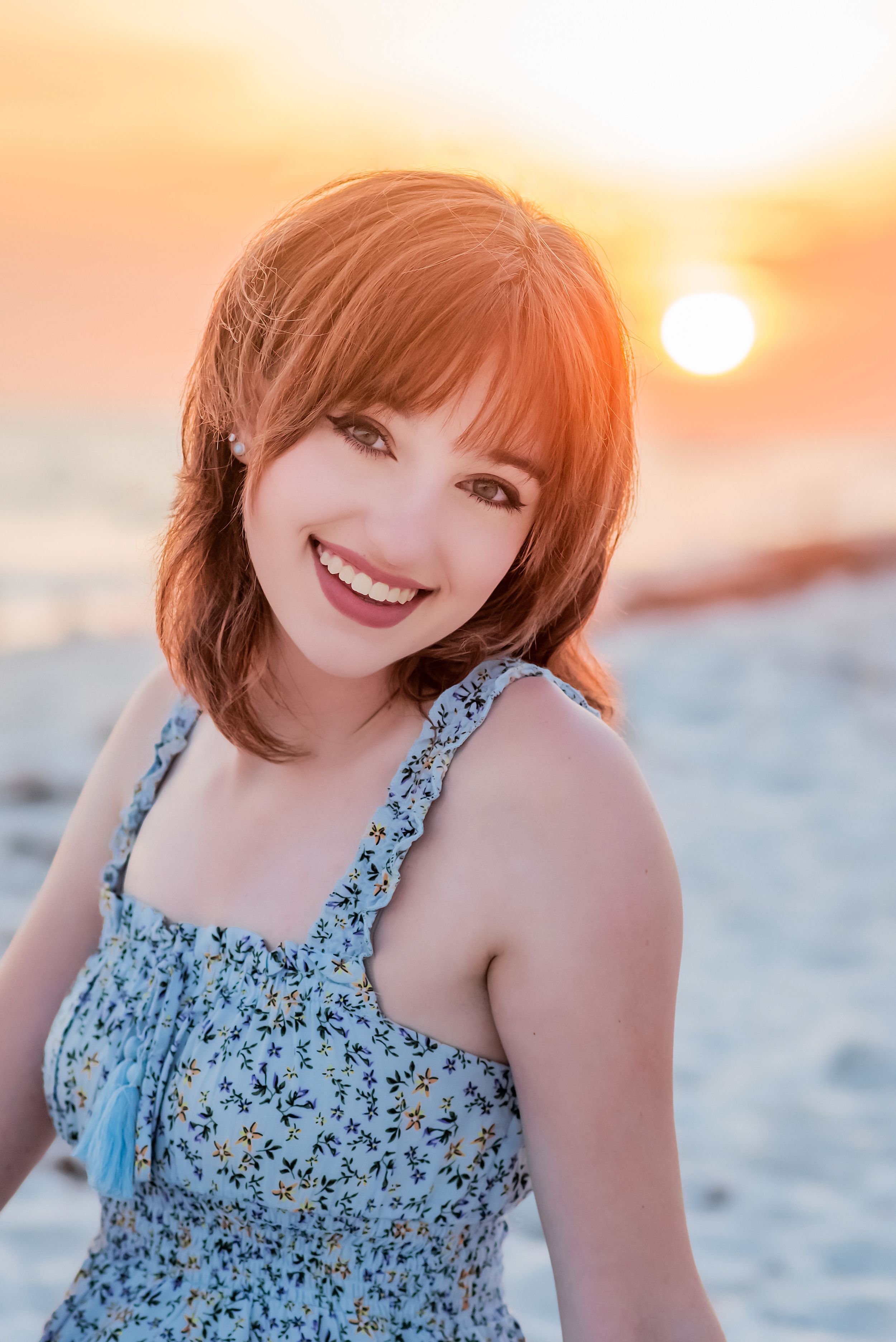 senior on beach during senior portrait beach session at sunset on Panama City Beach Florida