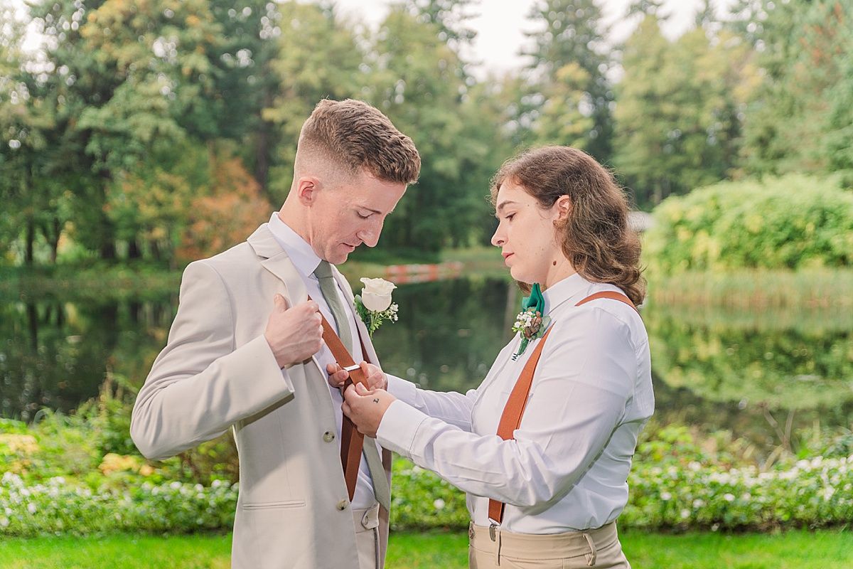 Groomswoman helping groom get ready