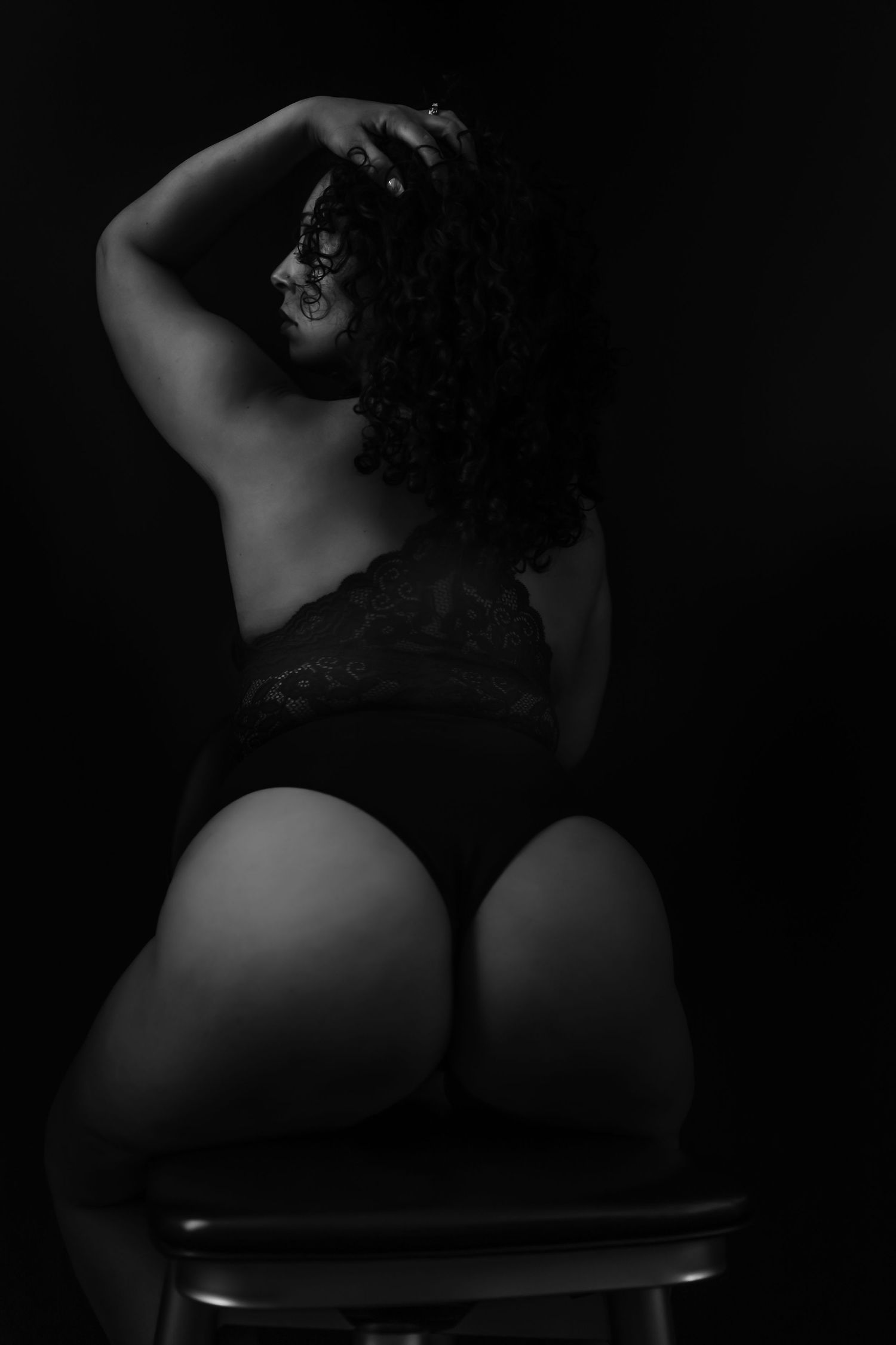 Artistic silhouette photography showcasing curves against dark background.