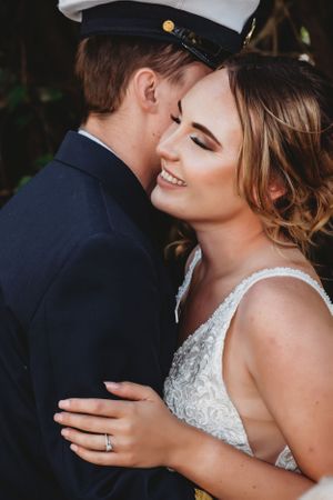 An intimate moment between newlyweds showing genuine joy and connection.