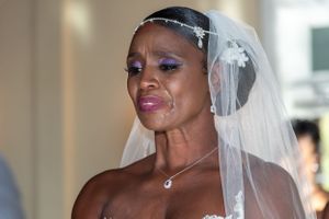Elegant bridal portrait featuring crystal headpiece and flowing white veil.