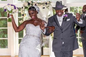 Happy newlyweds celebrate during wedding ceremony recessional.