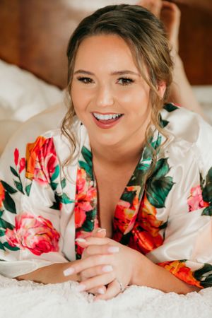 Close up portrait of person in floral silk robe with soft natural lighting.