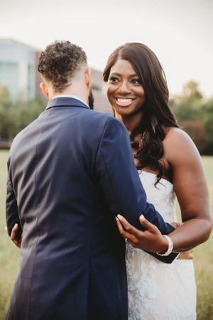 Intimate couple portrait during sunset wedding photography session in an outdoor setting.