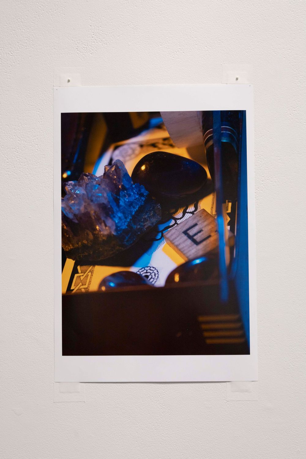 Close-up photograph of illuminated objects with blue lighting creating a dramatic nighttime atmosphere.