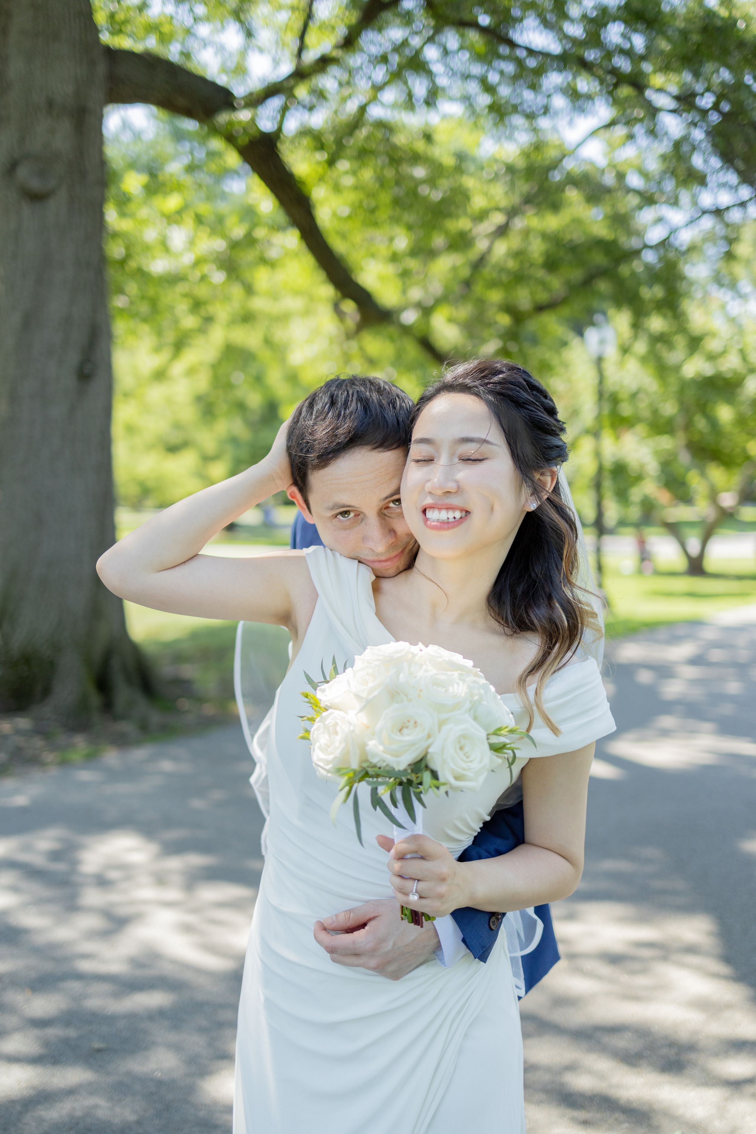 A playful sequence showing an intimate moment between a couple in a park with white flowers.