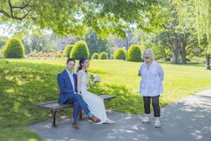 Series of romantic moments captured on a sunny park bench surrounded by greenery.