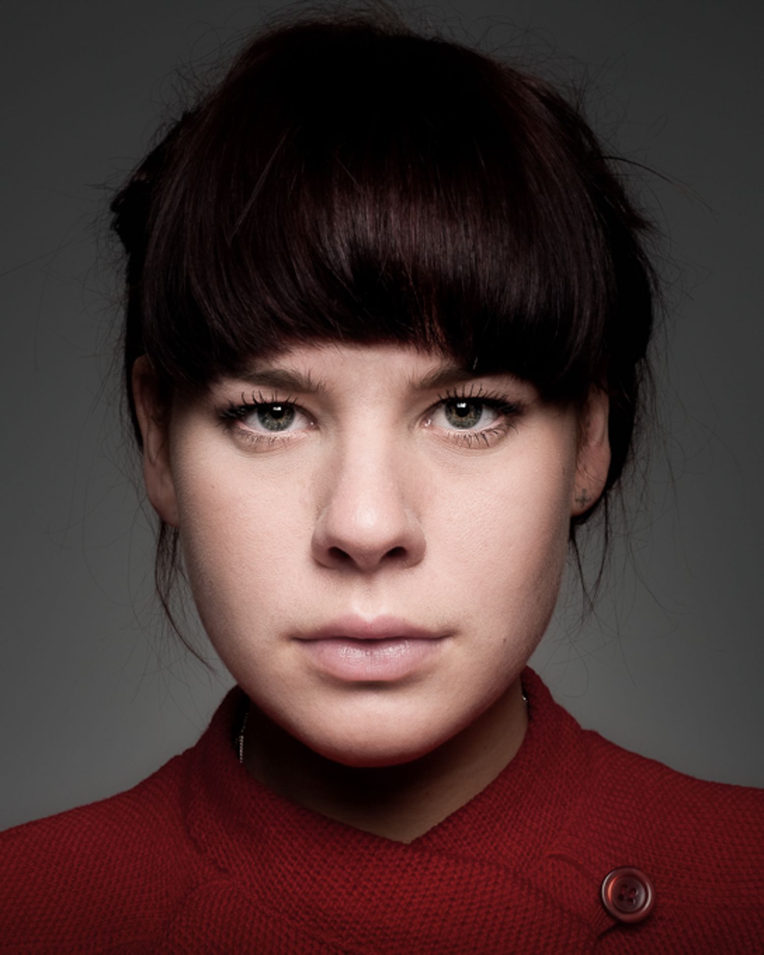 Close-up portrait series showing dark bangs and red sweater against dramatic lighting.