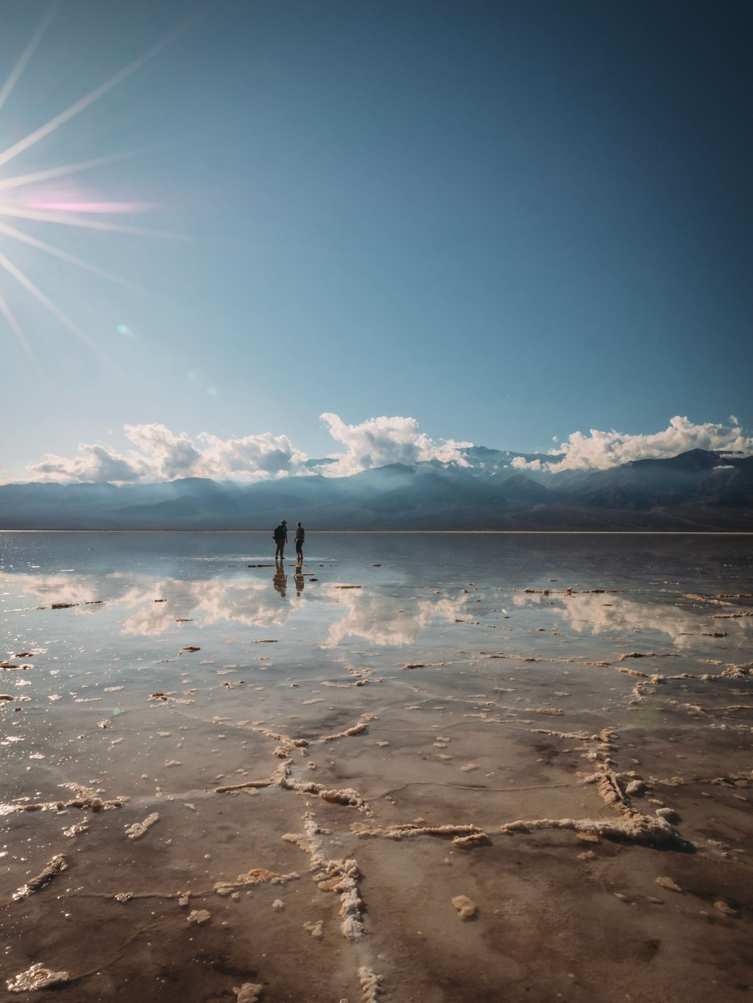 Hikers staring at the sun in DEATH VALLEY NATIONAL PARK, CALIFORNIA Located at the salt flats the lowest place on earth.