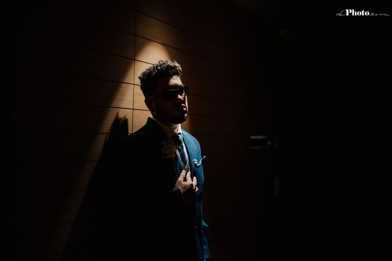 Dramatic silhouette portrait with moody lighting against a dark background.