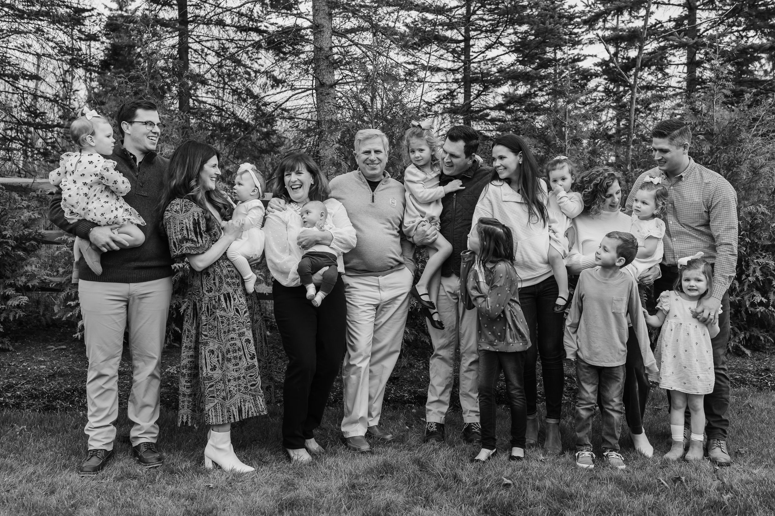 Large extended family gathering photo session