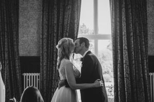 You may kiss the bride - bridge and groom kissing at their wedding in Crewe, Cheshire.