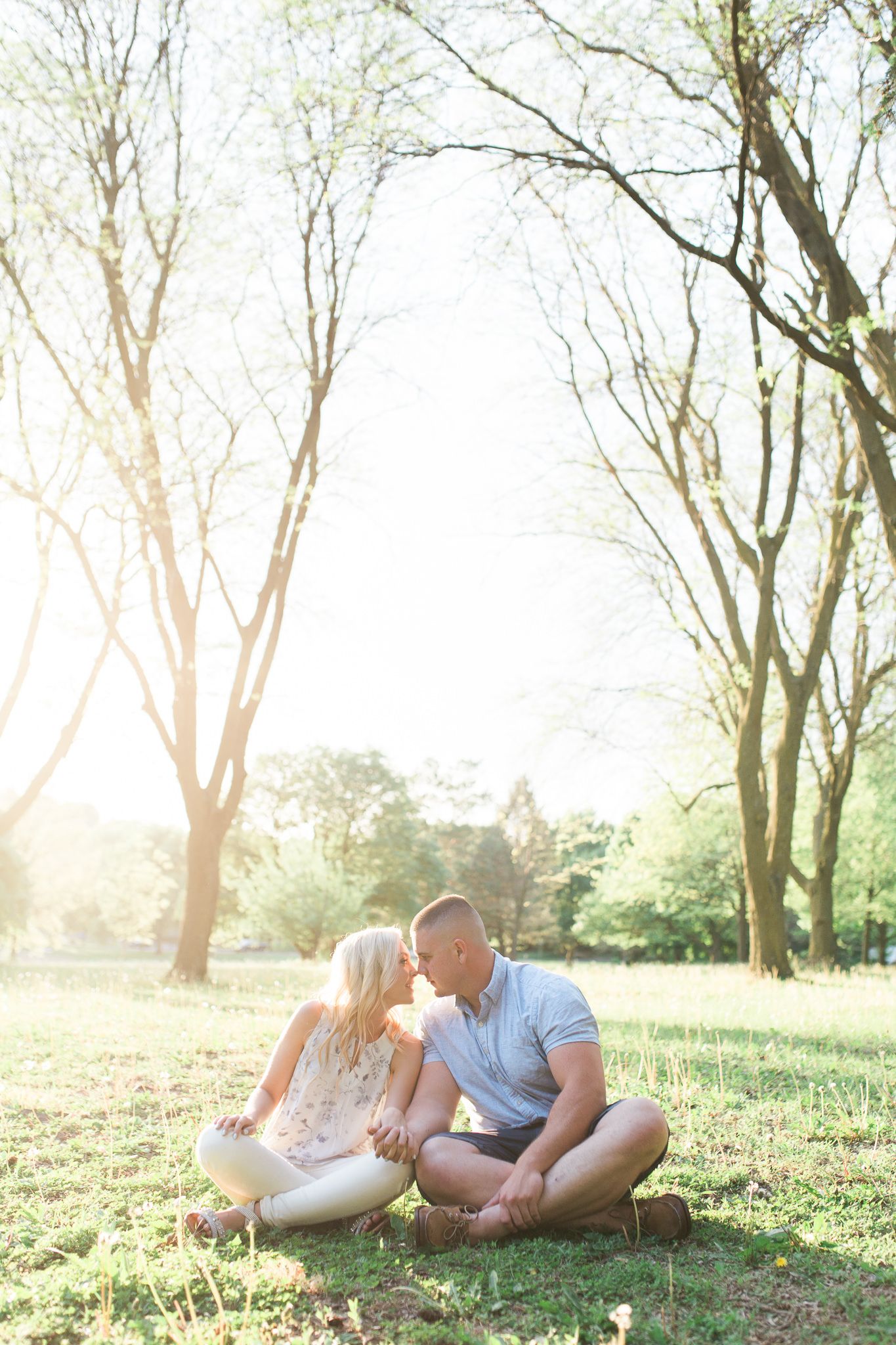 engagement photo in memorial park, natural couple photos, light and airy photograph, omaha wedding photographer nikki