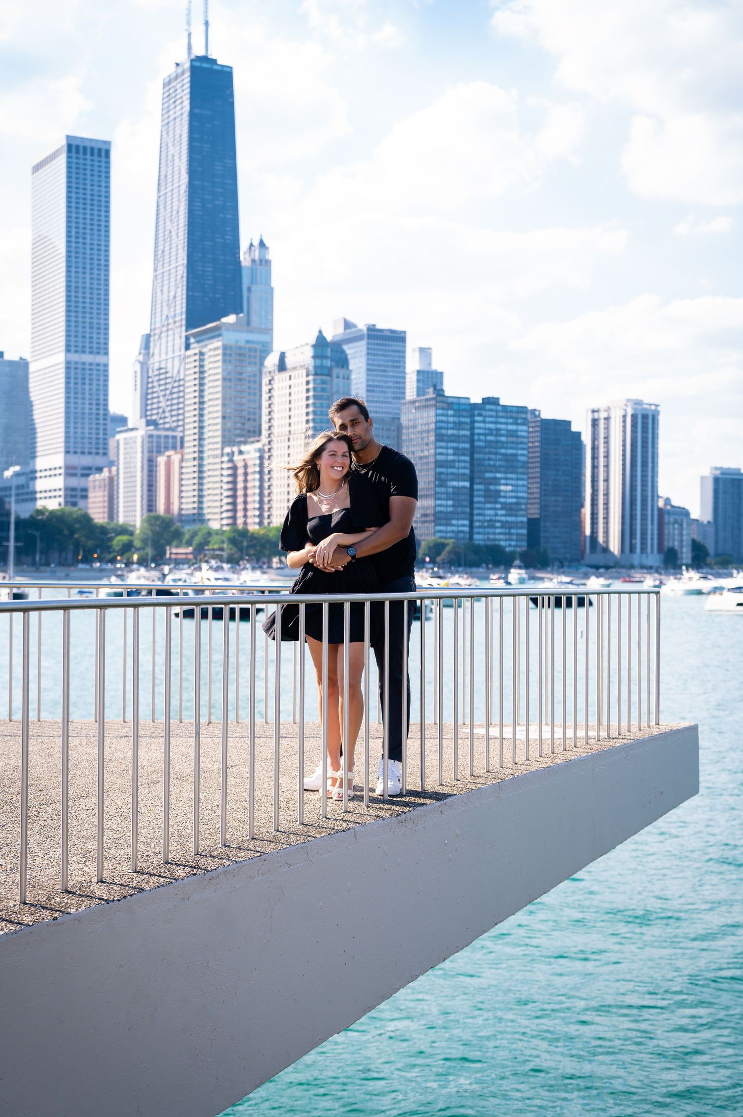 Urban engagement photos at Chicago waterfront with skyline backdrop.
