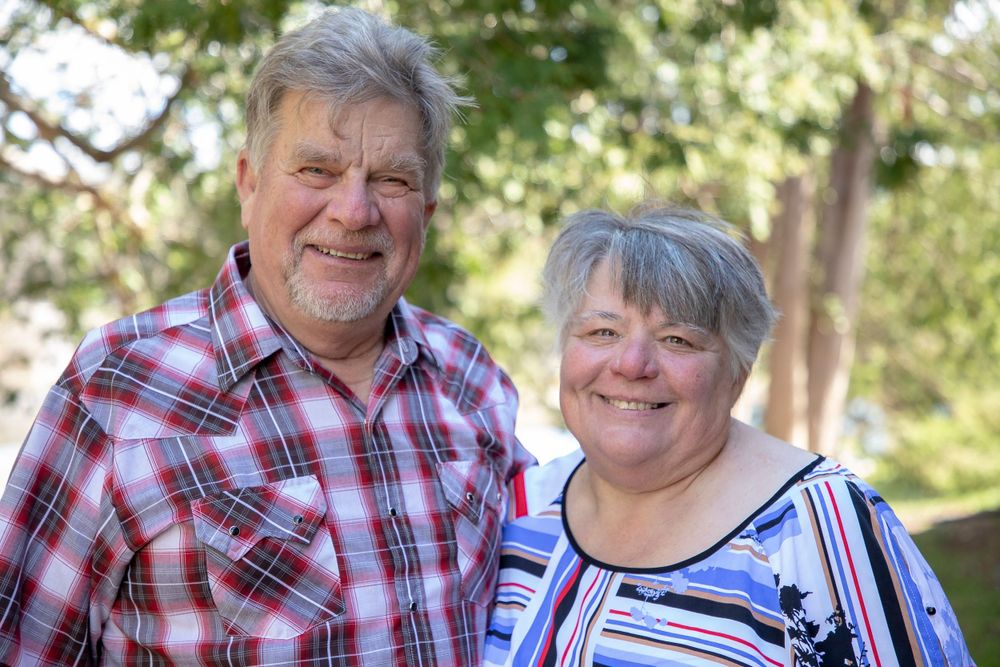 a portrait of an older couple gentleman on the left, lady on the right