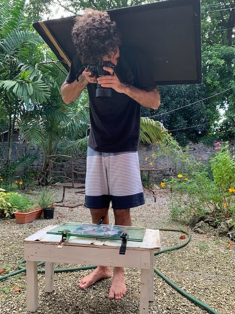 A BTS photo of Logan C Thomas photographing a Cyanolumen for QP Bistro fine art commission