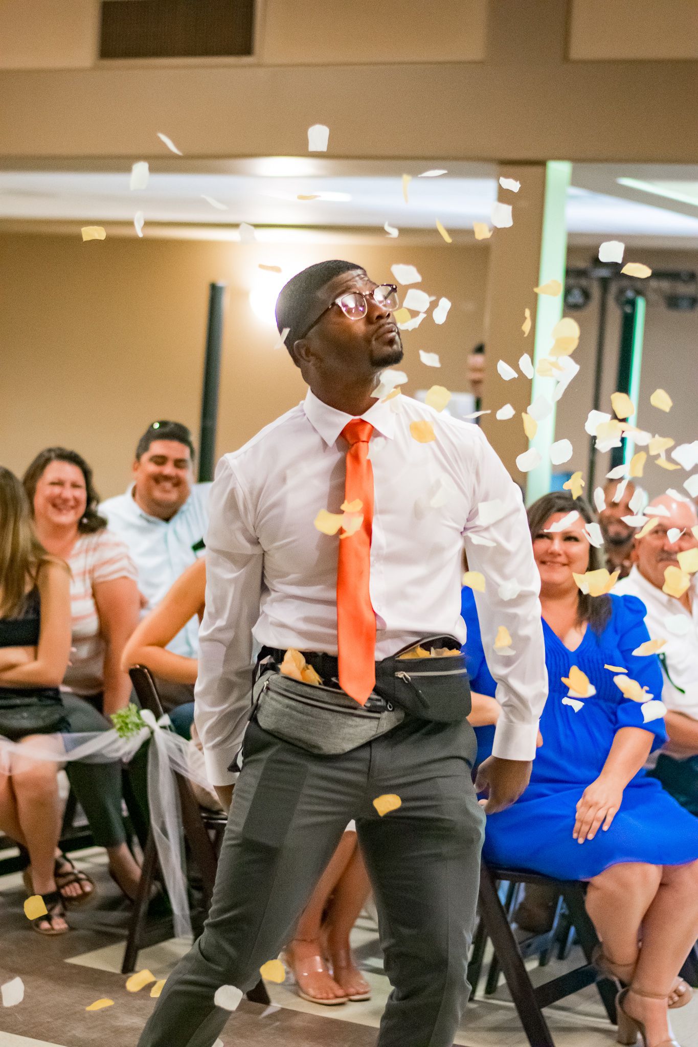 A celebration scene with confetti flying around a person dancing in business attire.