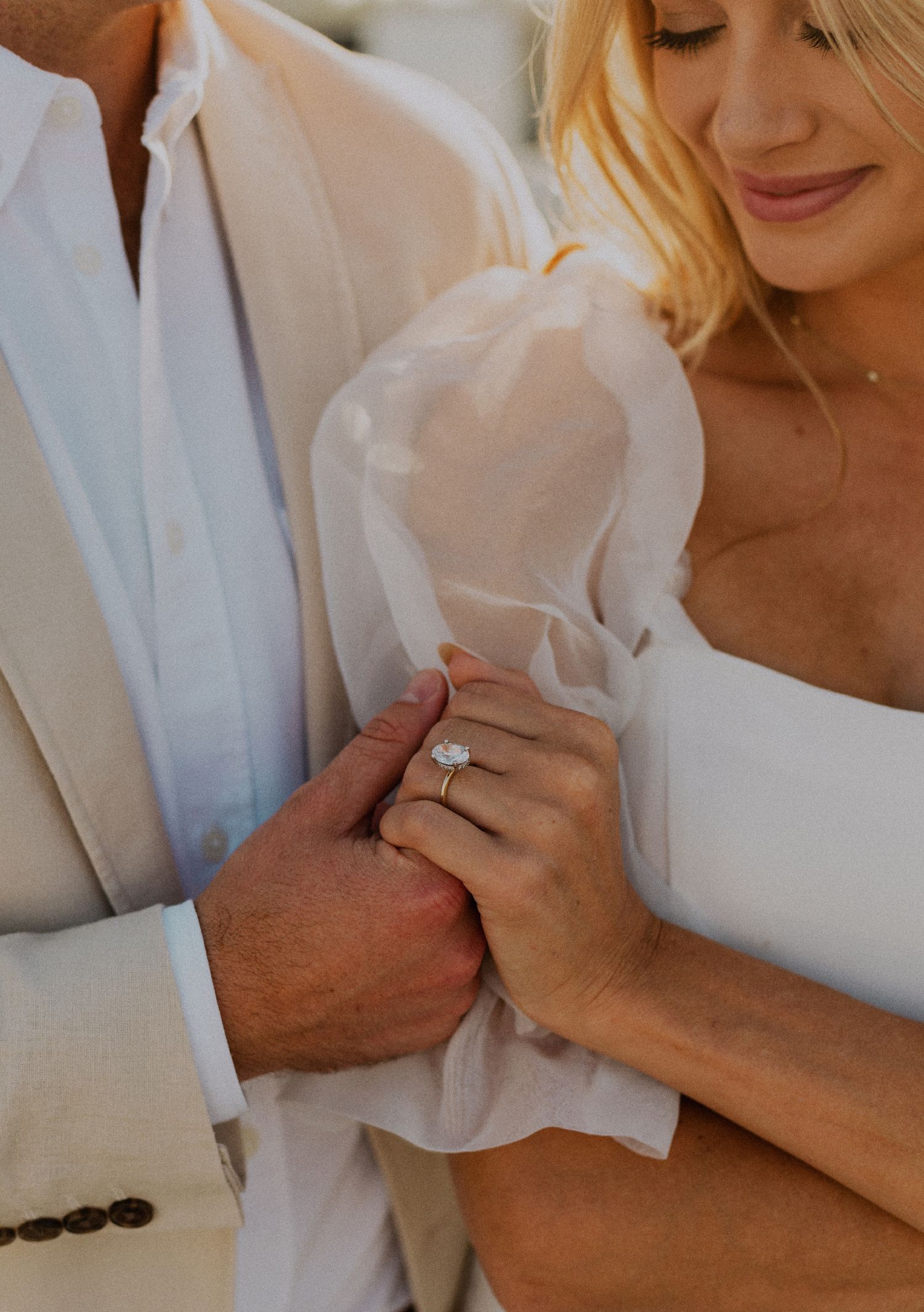 35mm ring detail photo of fun bridal themed engagement shoot on roof of parking structure in Lido Marina, Newport beach