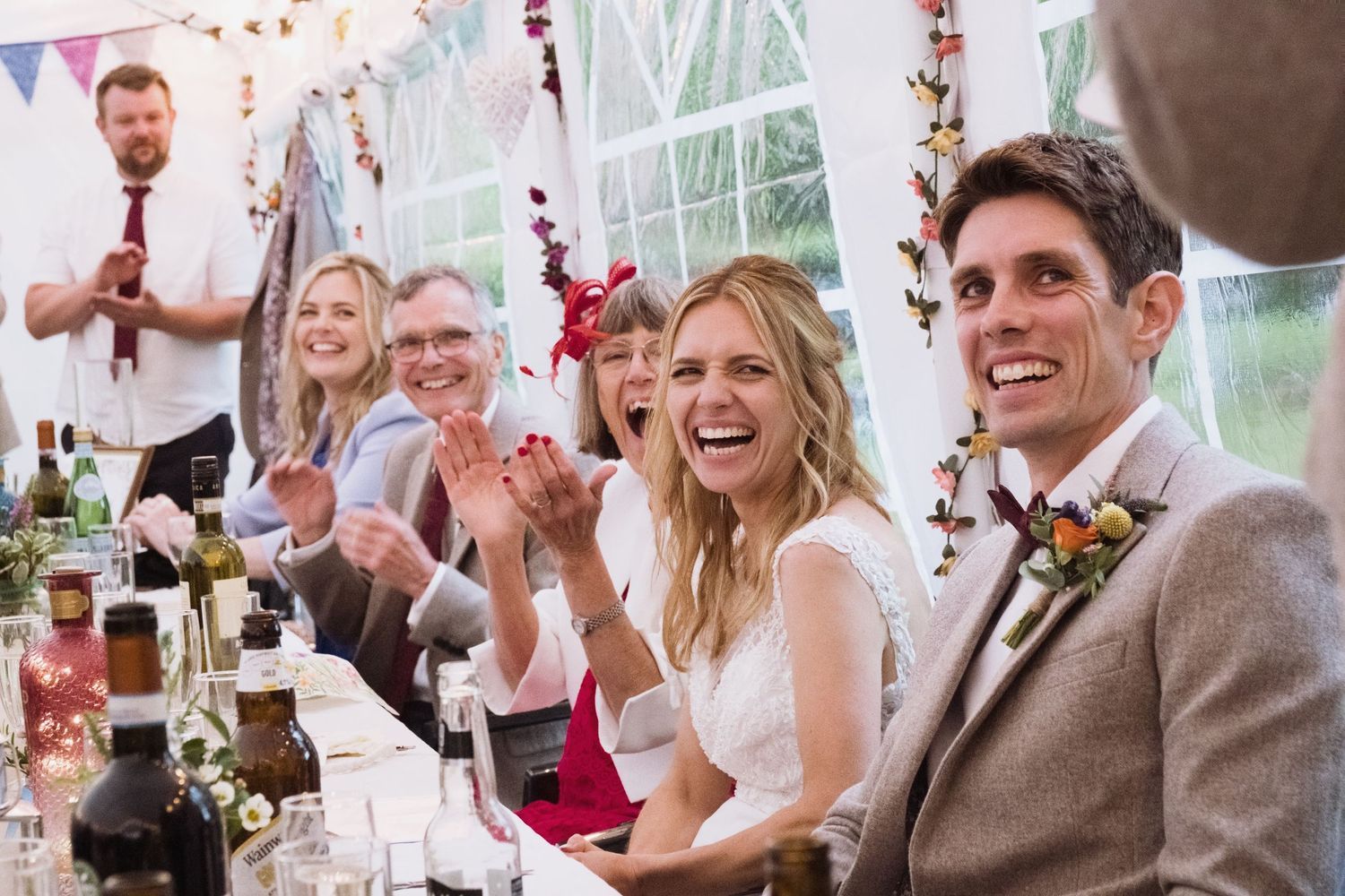 Newlywed bride and groom and their family at the reception tent at St Andrews Church Wraysbury Wedding