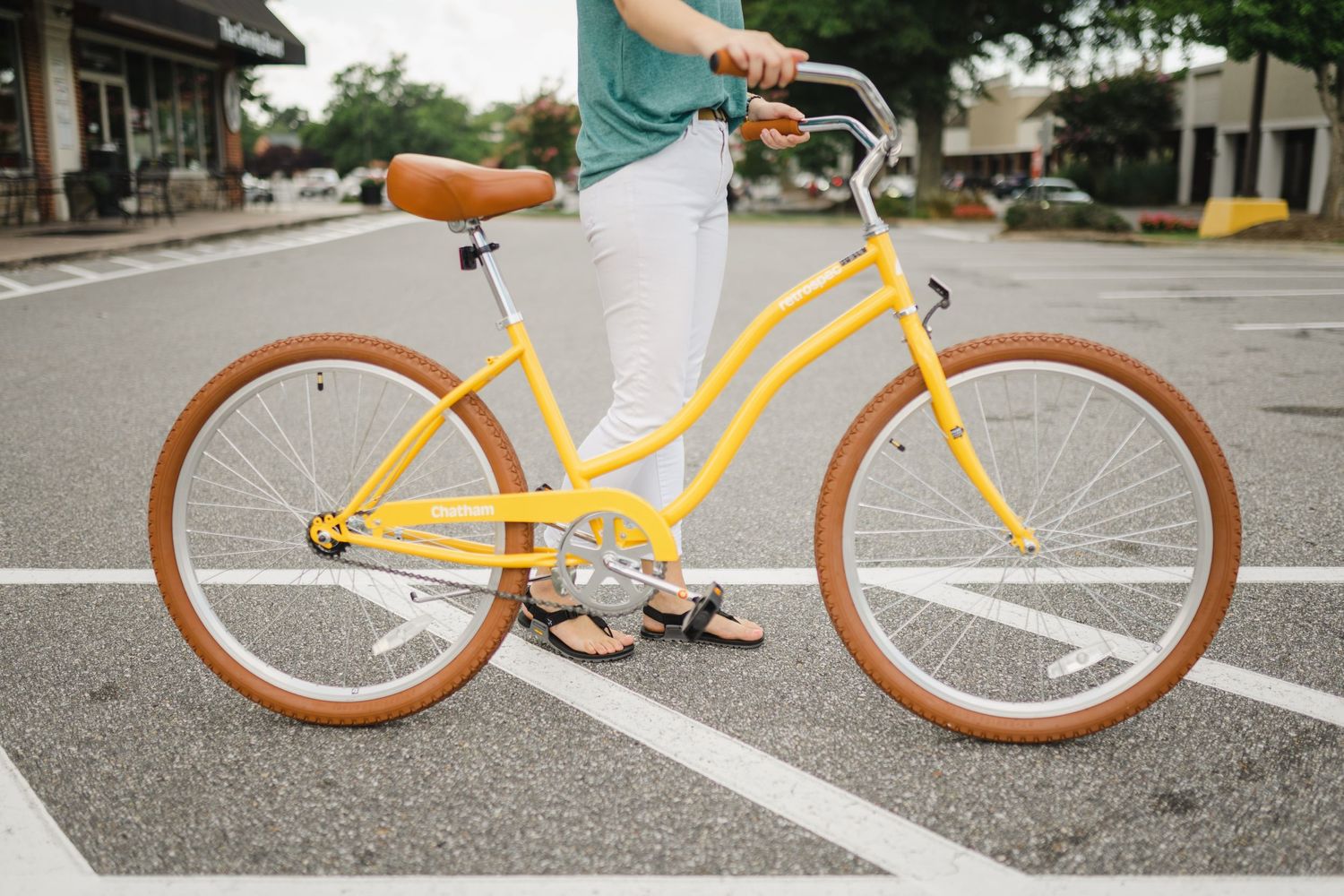 Personal walking with a yellow bike on street