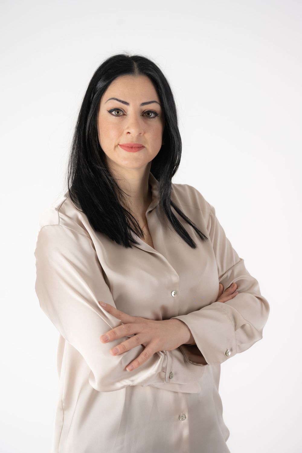 Business portrait series in beige blazer against white background showing confident poses.