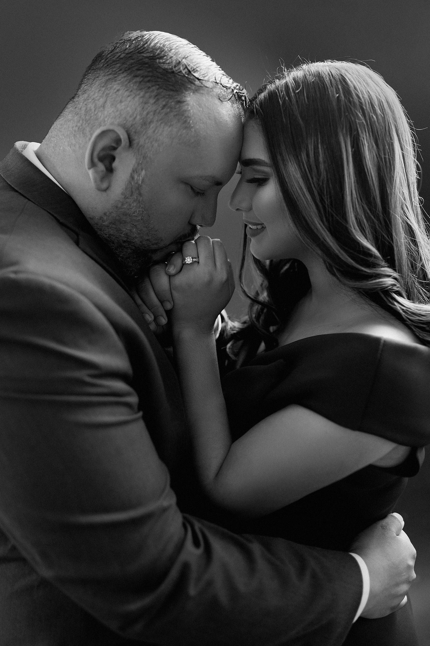 Intimate black and white couple portraits showing tender moments.