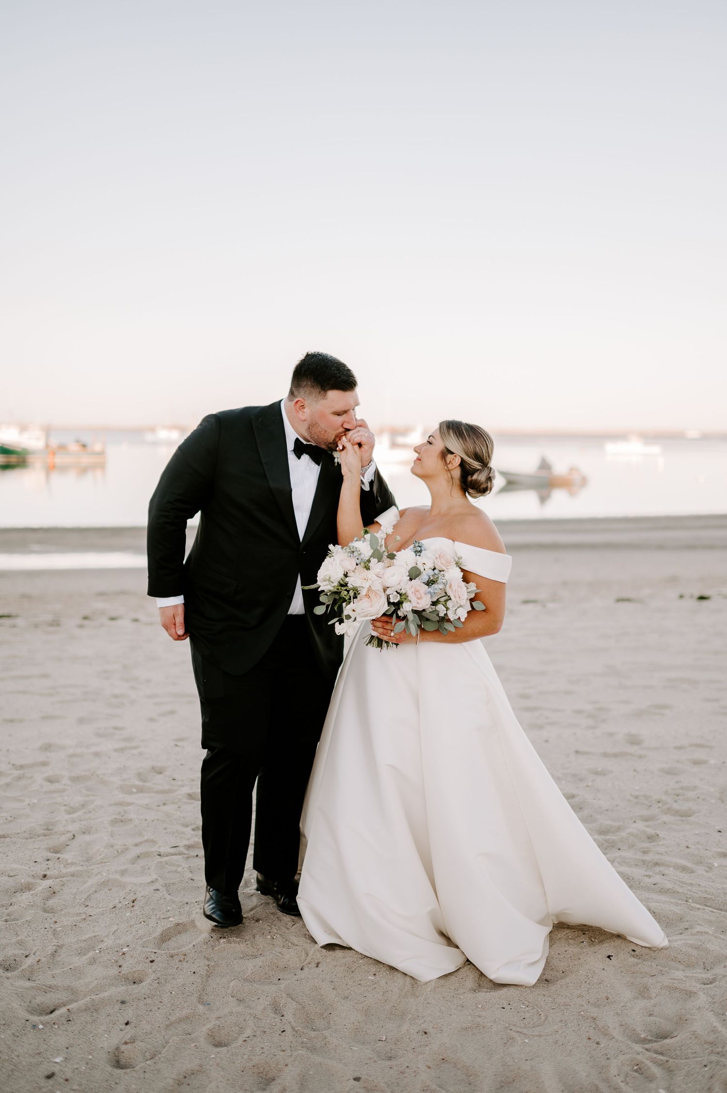 A series of intimate wedding photos capturing tender moments between newlyweds on a sandy beach.