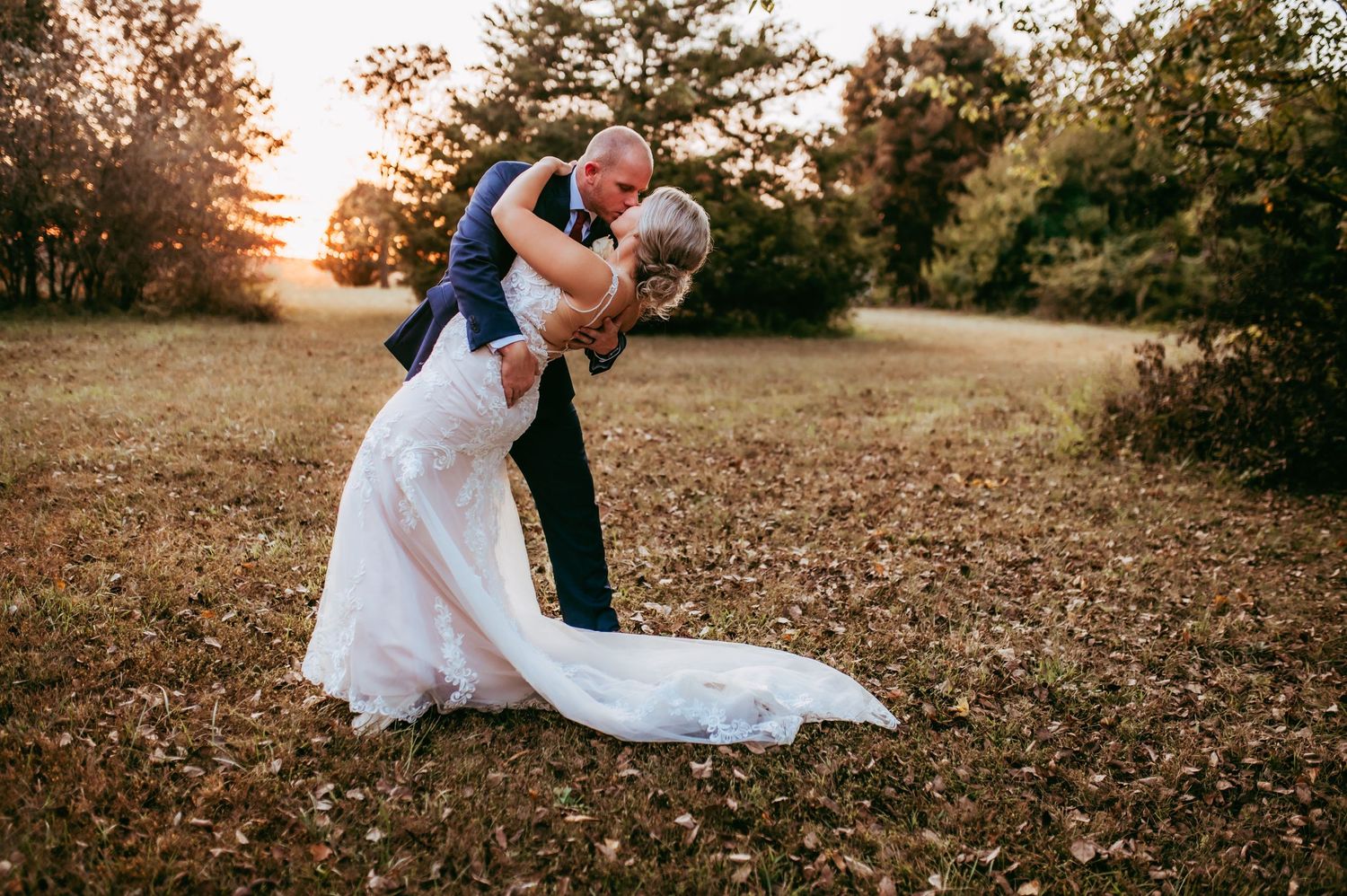 Kansas city wedding photographer. Romantic sunset dip. Bride and groom kiss, dip.