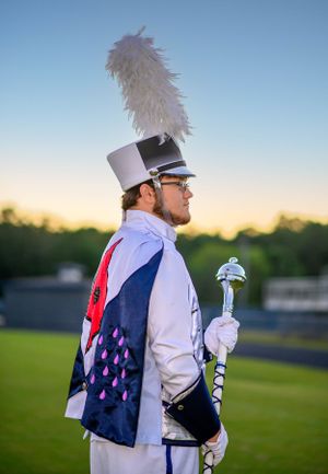 A senior in a marching band outfit.