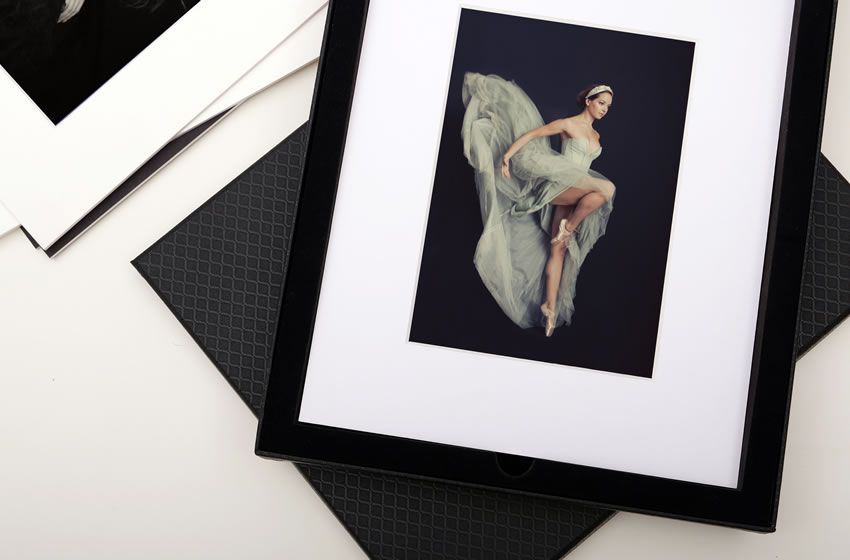 Preview of an opened diamond folio presentation box with fine art prints from Jade and Daniel's wedding.