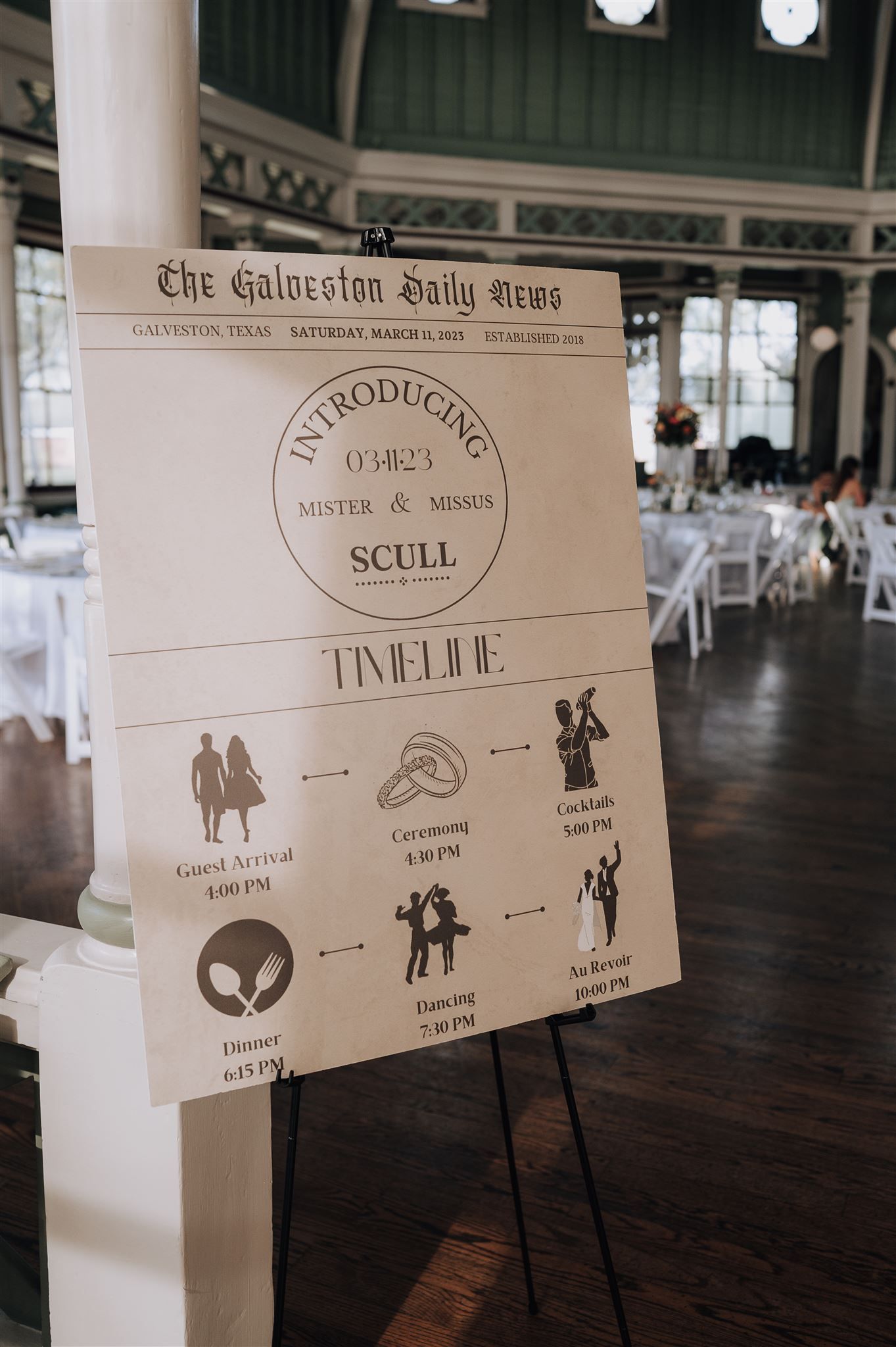Wedding timeline sign styled as a vintage newspaper with icons and schedule of events.