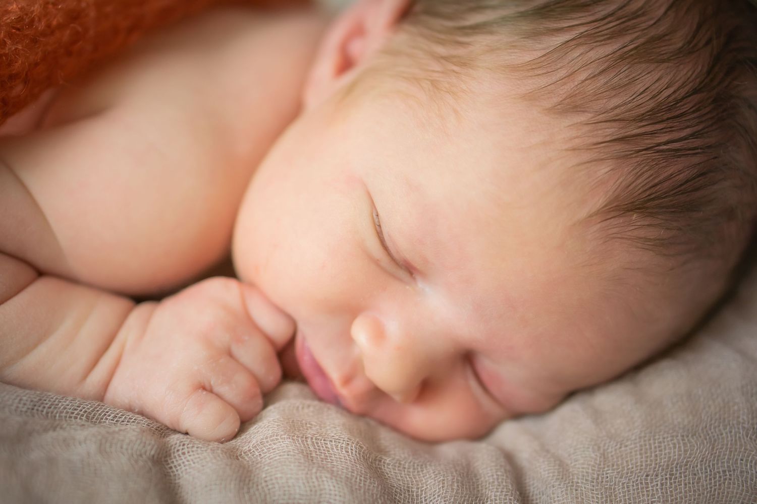 Close-up portrait of a peaceful sleeping newborn baby.