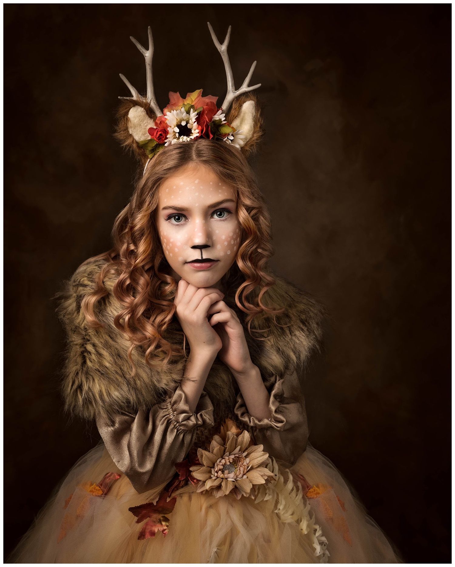 Fine art fantasy child portrait featuring girl wearing antler crown and styled costume photographed by Austin creative portrait photographer