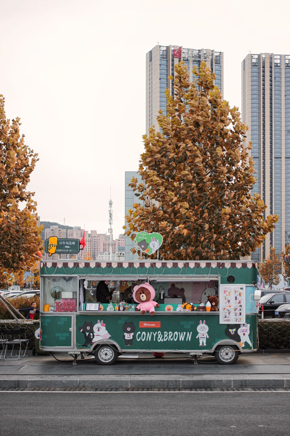 the corny brown-green minibus that seels snacks