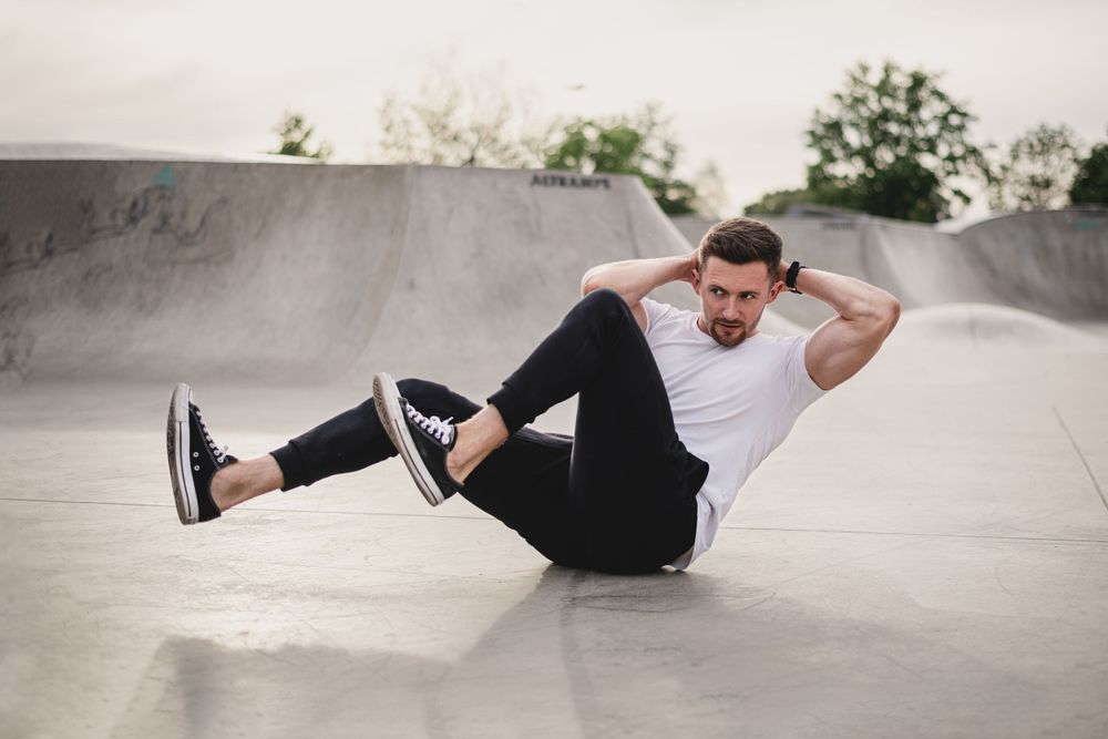 Series of dynamic poses on a concrete surface showing movement and flexibility.