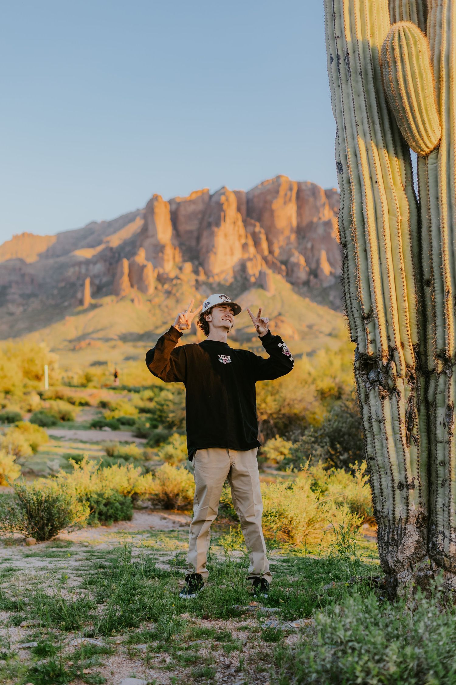 Adventure photography in the Superstition Mountains featuring casual outfit and desert landscape.