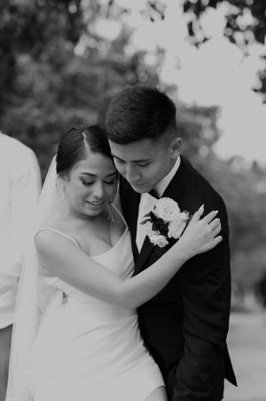 Romantic black and white wedding portraits show tender moments between newlyweds.