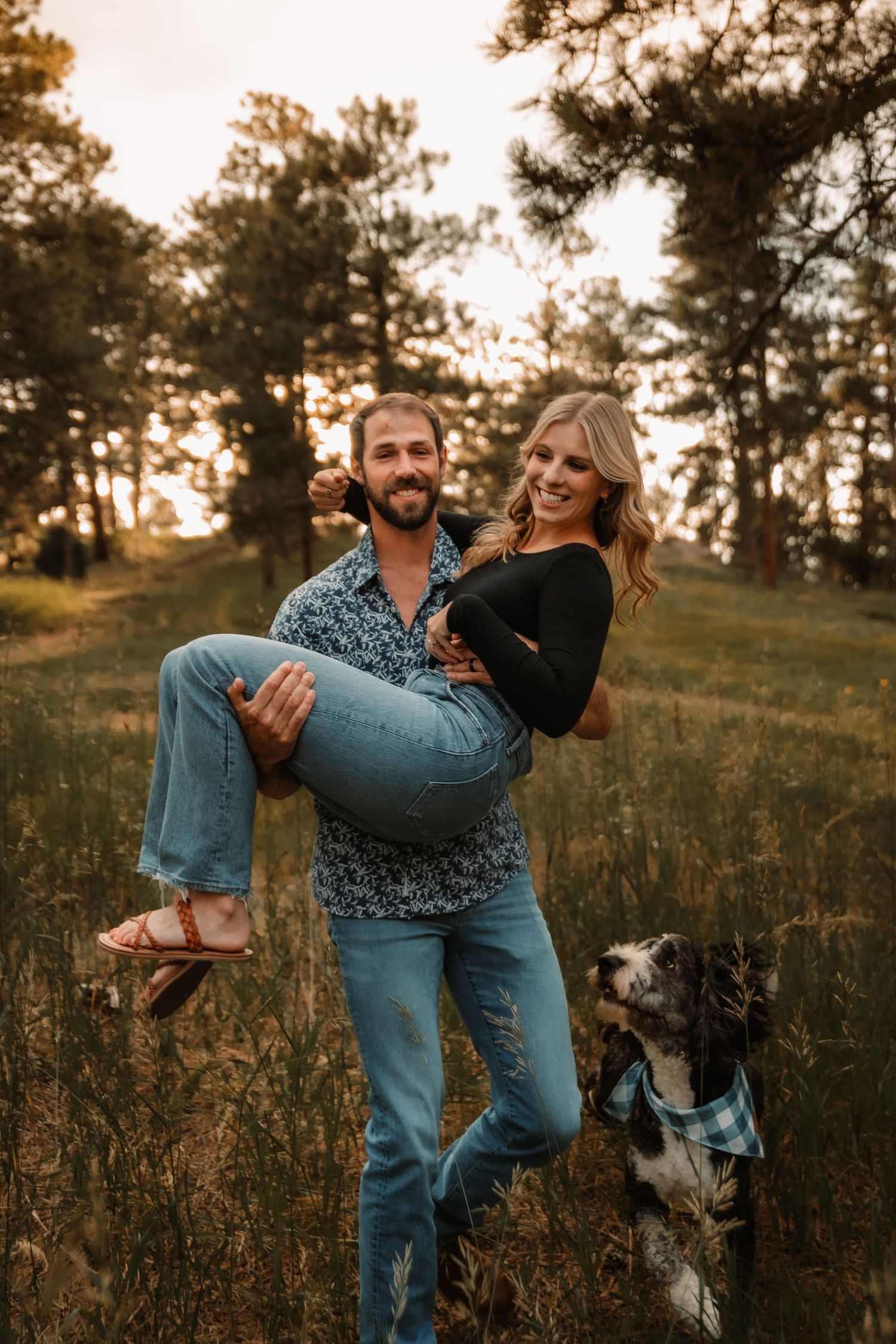 Husband lifting wife up while walking with dog by Vine Photography in Salem Ohio